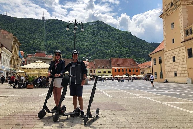 Brasov Old Town Guided Tour With Electric Scooters - Stop by Stop: Draper Bastion and the Promenade Under Tâmpa