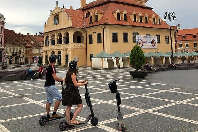 Brasov Old Town Guided Tour With Electric Scooters - Churches, Rope Street, and the Feeling of an Old-Town Walk