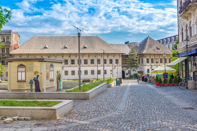 Bucharest one day tour with Parliament Palace and Village Museum - Panoramic ride: Cantacuzino, the Romanian Athenaeum, and royal echoes