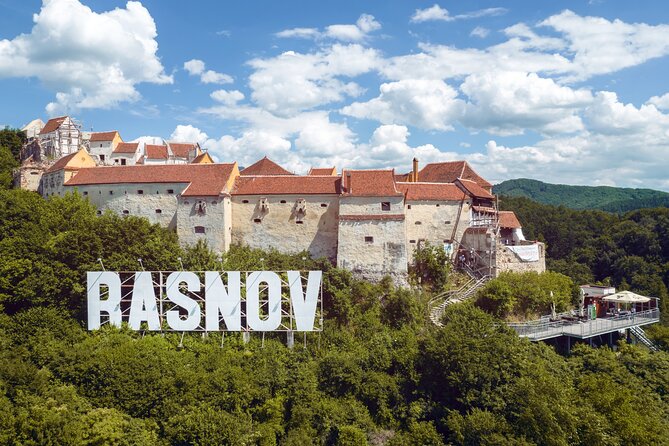 Peles Castle, Bran Castle & Rasnov Fort. Private Tour from Brasov - Rasnov Citadel when the interior is closed: garden, gate, and views